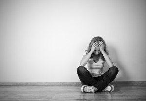 bigstock-Girl-Sits-In-A-Depression-On-T-52227706-300x207